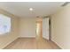 Bedroom featuring light walls and laminate flooring, with a white door leading to another room at 2026 Arkansas Ave, Englewood, FL 34224