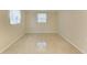 Neutral bedroom with window letting in natural light at 2026 Arkansas Ave, Englewood, FL 34224