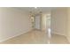 Bedroom with en suite bathroom and access to back patio at 2026 Arkansas Ave, Englewood, FL 34224