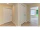 Bright entryway with light hardwood floors at 2026 Arkansas Ave, Englewood, FL 34224