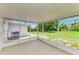 Relaxing screened patio with a view of the backyard at 2026 Arkansas Ave, Englewood, FL 34224