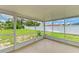Inviting screened patio overlooking a lush, green backyard at 2026 Arkansas Ave, Englewood, FL 34224