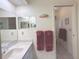 Bathroom featuring a single sink vanity and decorative towels and art at 22321 Yonkers Ave, Port Charlotte, FL 33952