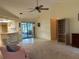 Open concept living space flows to the kitchen and screened patio, creating seamless indoor-outdoor living at 22321 Yonkers Ave, Port Charlotte, FL 33952