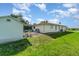 Spacious backyard with well-maintained lawn and an enclosed patio, perfect for entertaining at 22434 Walton Ave, Port Charlotte, FL 33952