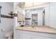 Bathroom featuring a large mirror and patterned wallpaper border at 22434 Walton Ave, Port Charlotte, FL 33952