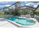 Private screened-in pool with two floating rubber ducks, ideal for summer relaxation at 22434 Walton Ave, Port Charlotte, FL 33952