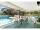 Screened-in pool area with a covered patio, perfect for outdoor entertaining and relaxation at 22434 Walton Ave, Port Charlotte, FL 33952