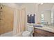 Clean bathroom with a shower and bathtub combo, vanity with granite countertop, and stylish fixtures at 226 Tapa Parish Run, Bradenton, FL 34212