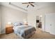 Relaxing bedroom features a queen bed with neutral colors, carpeted floors, and ensuite bathroom and closet at 226 Tapa Parish Run, Bradenton, FL 34212