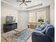 Comfortable living room with cozy seating, natural light, and a television at 226 Tapa Parish Run, Bradenton, FL 34212