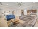 Bright and open floor plan connecting the living room and kitchen, featuring tile floors and lots of natural light at 226 Tapa Parish Run, Bradenton, FL 34212