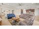 Spacious living room with tile floors, comfortable seating, and an open floor plan to the kitchen at 226 Tapa Parish Run, Bradenton, FL 34212