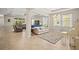 Bright and airy living room boasting tile floors and a cozy seating area with lots of natural light at 226 Tapa Parish Run, Bradenton, FL 34212