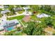 Aerial shot capturing the home's location, neighboring properties, and mature trees at 2315 Riverwood Pines Dr, Sarasota, FL 34231