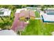 Aerial view of home with a spacious backyard featuring a pool and turf at 2315 Riverwood Pines Dr, Sarasota, FL 34231