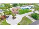 Bird's-eye view of home, lush landscaping, and nearby residences at 2315 Riverwood Pines Dr, Sarasota, FL 34231