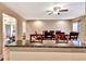 Kitchen bar area with a view into a dining room with a large wood table at 2315 Riverwood Pines Dr, Sarasota, FL 34231