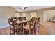 Spacious dining room featuring seating for eight and hardwood floors at 2315 Riverwood Pines Dr, Sarasota, FL 34231