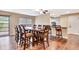 Open dining area with seating for ten, a ceiling fan, and natural light at 2315 Riverwood Pines Dr, Sarasota, FL 34231