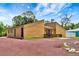Charming single-story home showcasing a unique architectural design and inviting front porch at 2315 Riverwood Pines Dr, Sarasota, FL 34231