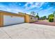 Exterior view of the home featuring a two-car garage and expansive driveway for parking at 2315 Riverwood Pines Dr, Sarasota, FL 34231