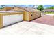 Side view of home featuring an attached garage and a concrete driveway at 2315 Riverwood Pines Dr, Sarasota, FL 34231