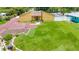 Front aerial of home, showcasing the ample front yard and modern landscaping at 2315 Riverwood Pines Dr, Sarasota, FL 34231