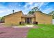 Charming single-story home with modern design and unique landscaping in the front yard at 2315 Riverwood Pines Dr, Sarasota, FL 34231
