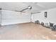 Spacious garage with a white door and ample room for storage and parking at 2315 Riverwood Pines Dr, Sarasota, FL 34231