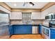 Well-lit kitchen with granite countertops, stainless appliances, and hardwood floors at 2315 Riverwood Pines Dr, Sarasota, FL 34231