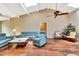 The living room has high ceilings, wood floors, comfortable seating and lots of light at 2315 Riverwood Pines Dr, Sarasota, FL 34231