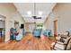 Spacious living room with vaulted ceilings, exposed beams, lots of natural light, and wood flooring at 2315 Riverwood Pines Dr, Sarasota, FL 34231