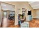 Open living room with a connected dining area and living space with natural light and wood floors at 2315 Riverwood Pines Dr, Sarasota, FL 34231