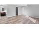 This spacious bedroom features wood-look flooring, neutral walls, and ample natural light, showcasing a walk-in closet at 2405 Mistleto Ln, North Port, FL 34286