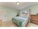 Cozy bedroom features ample natural light and tile floors at 2406 15Th W St, Palmetto, FL 34221