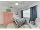 Cozy bedroom with natural light, features a comfortable bed, and is tastefully decorated at 2406 15Th W St, Palmetto, FL 34221
