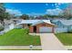Charming single-Gathering home with a well-maintained lawn, white picket fence, and a one-car garage at 2406 15Th W St, Palmetto, FL 34221