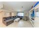 Inviting living room with a large comfortable sofa, and a built-in entertainment center at 2406 15Th W St, Palmetto, FL 34221