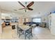 An open concept living space combines a kitchen, dining area and seating area at 2406 15Th W St, Palmetto, FL 34221