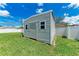 Well-maintained shed with a door and windows, providing additional storage space at 2406 15Th W St, Palmetto, FL 34221