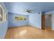 This bedroom offers hardwood floors, ceiling fan, and a closet at 2850 Bon Air Ave, Sarasota, FL 34234