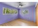 This bedroom features beautiful hardwood floors and a ceiling fan at 2850 Bon Air Ave, Sarasota, FL 34234