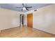 A simple bedroom with a ceiling fan and a wooden closet at 2850 Bon Air Ave, Sarasota, FL 34234