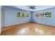 Bright bedroom features hardwood floors and natural light from the windows at 2850 Bon Air Ave, Sarasota, FL 34234