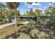 Charming single-story home with mature landscaping and a cozy front porch at 2850 Bon Air Ave, Sarasota, FL 34234