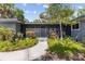 A close-up of the front porch and facade of a charming one story home at 2850 Bon Air Ave, Sarasota, FL 34234