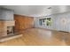 Sun-filled living area with hardwood floors and cozy fireplace at 2850 Bon Air Ave, Sarasota, FL 34234
