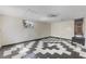 Spacious Bonus Space with black and white flooring at 2850 Bon Air Ave, Sarasota, FL 34234