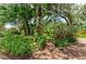 Backyard brick path surrounded by lush landscaping at 3217 Oak Grove Dr, Sarasota, FL 34243